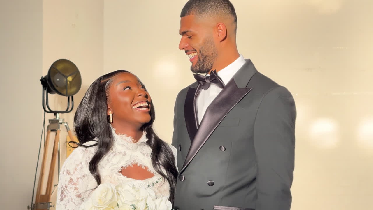 A bride and groom laughing together, captured as part of event coverage